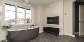 A beautiful shot of a modern house bathroom with technology and art