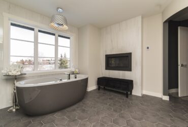 A beautiful shot of a modern house bathroom with technology and art