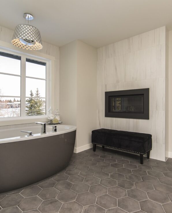 A beautiful shot of a modern house bathroom with technology and art