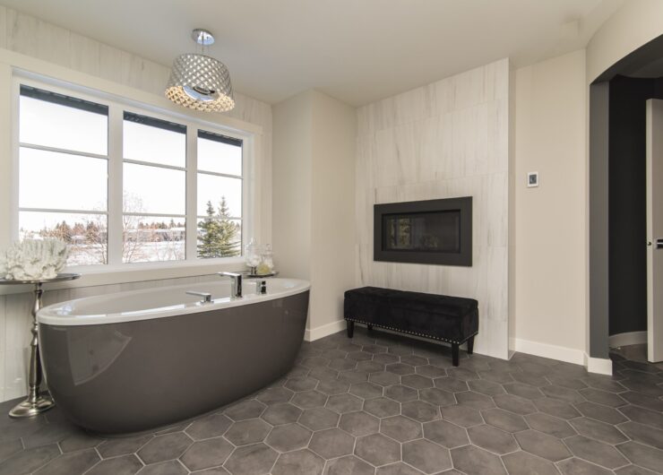 A beautiful shot of a modern house bathroom with technology and art