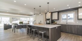 A beautiful shot of a modern house kitchen and dining room