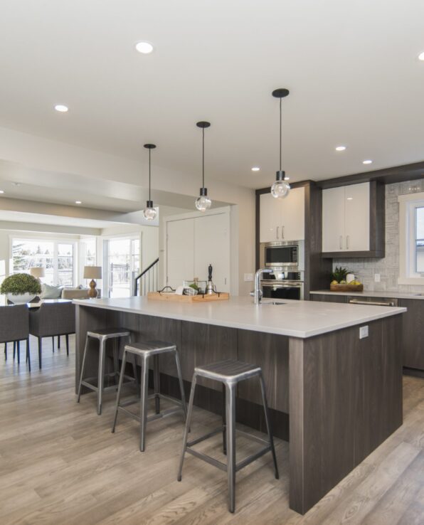 A beautiful shot of a modern house kitchen and dining room