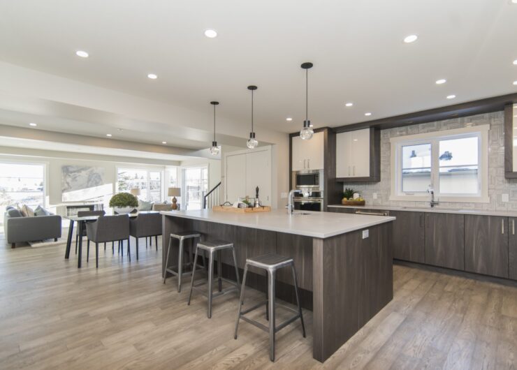 A beautiful shot of a modern house kitchen and dining room